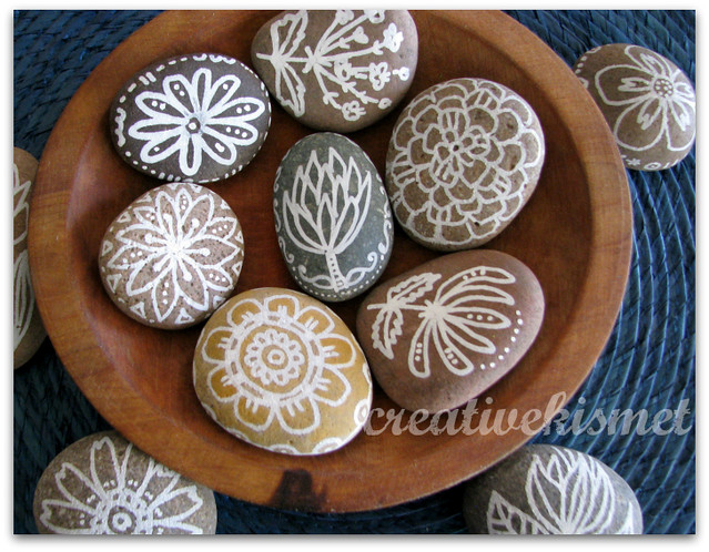 Hand painted rocks by Regina Lord