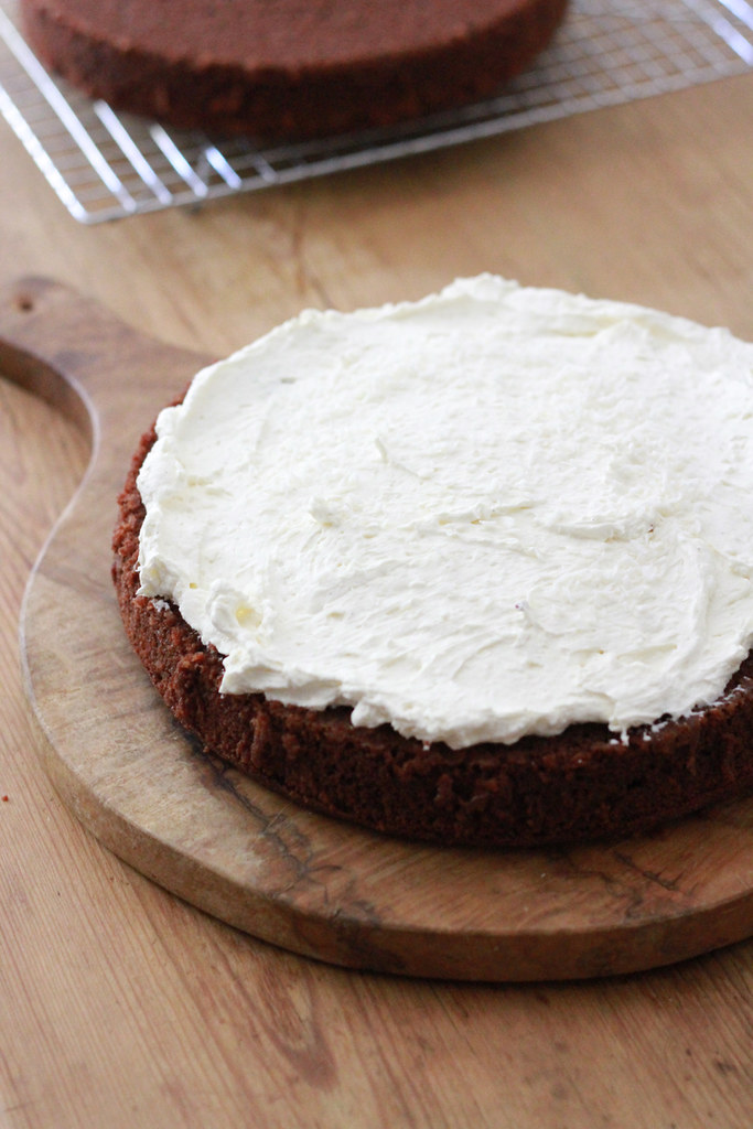 chocolate cake with whipped cream and cream cheese frosting