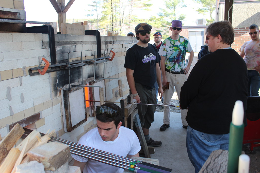 The group blowing glass.