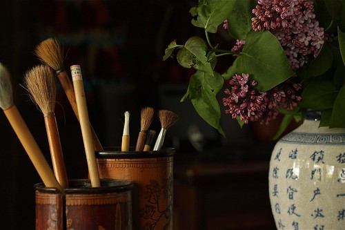 Chinese Brushes and a Vase of Lilacs