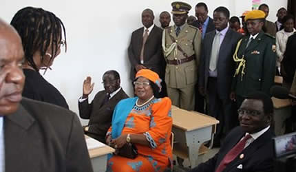 President Mugabe and visiting Malawian President Joyce Banda and her husband Retired Chief Justice Richard Banda simulate a class situation with First Lady Amai Grace Mugabe being the teacher at Amai Grace Mugabe School in Mazowe April 26, 2013. by Pan-African News Wire File Photos