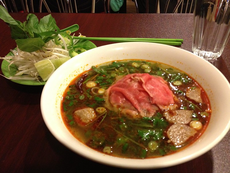 Bowl of spicey lemongrass Pho with thin sliced rib eye steeak and meatballs