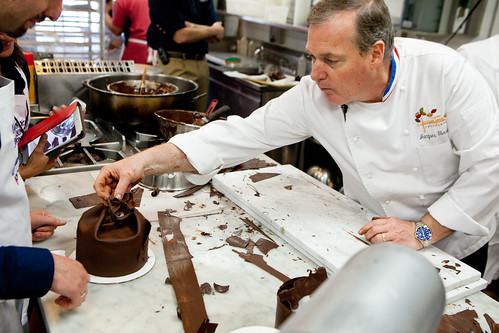 At Jacques Torres assisting rolling out the chocolate fondant at his "Cake Decorating and Chocolate Work" class