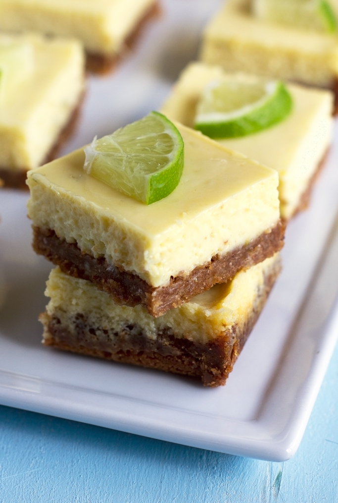 squares of key lime pie stacked on white plate