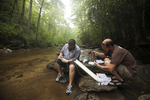 From left, biologist Jeff Humphries and field technician Michael Sisson, both with the North Carolina Wildlife Resources Commission, monitor hellbender populations in a Pisgah National Forest stream. (Copyright photo courtesy Freshwaters Illustrated/Dave Herasimtschuk)