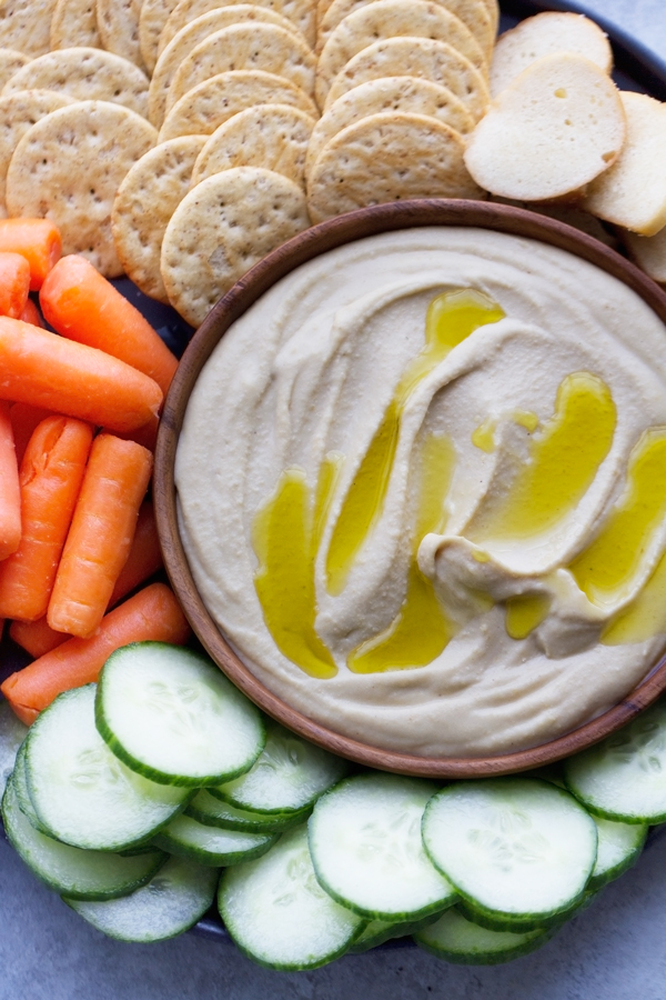 Roasted Garlic Hummus with Feta - Learn how to make the smoothest hummus ever with just a simple trick! #roastedgarlic #roastedgarlichummus #hummus | Littlespicejar.com