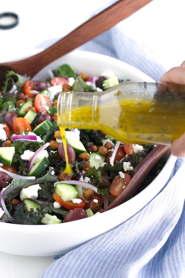 Kale Greek Salad with Roasted Chickpea Croutons - this salad it loaded with so much flavor. Drizzled with lemon vinaigrette. SO GOOD! #greeksalad #kalesalad #roastedchickpeas | Littlespicejar.com