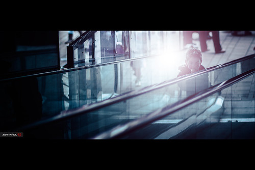 street city light boy cinema netherlands glass canon eos kid eyes escalator streetphotography 85mm special staircase flare stare burst f18 cinematic 2012 emmen ef85mmf18usm 60d canon60d img8446 jeffkrol