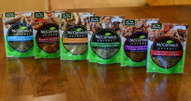 A variety of Mccormick recipe mixes arranged on a table.