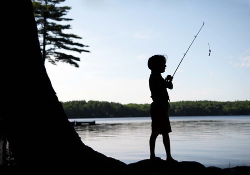 boy sunset summer lake fish water childhood silhouette fishing maine happiness innocence wilderness fishingpole oldfashioned