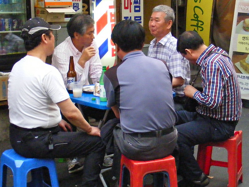 Men enjoying Food and Beer in Seoul, South Korea 