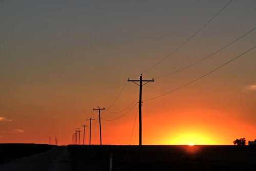 sunset illinois telephone poles bement