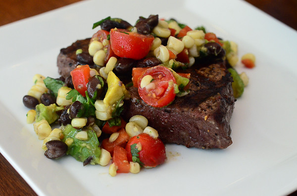 Grilled Steak with Grilled Corn and Black Bean Salsa on a plate.