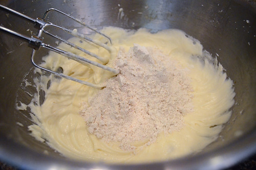 The flour mixture is added to the bowl of ingredients.