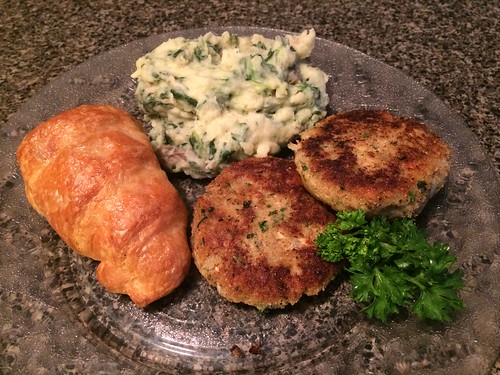 dish dinner food plate kitchen counter salmon croquettes croquette canned spinach mashed potatoes crescent roll parsley