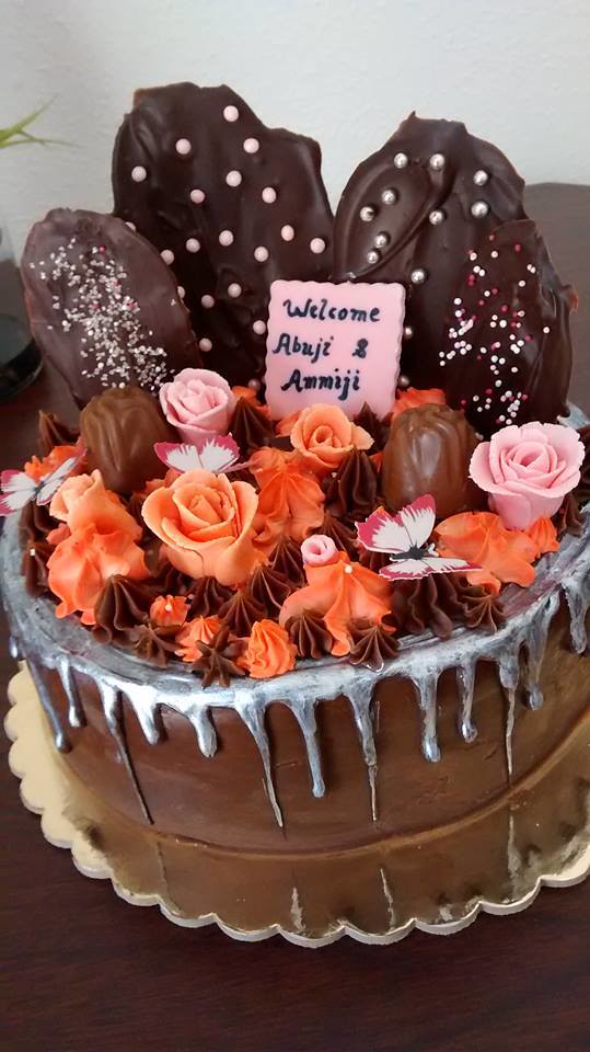 Chocolate ganache cake with hand made chocolates and sugar flowers by Maria Rizwan of The Cakeville
