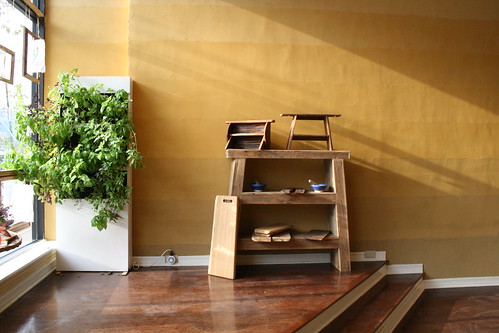 Front display of cutting boards, furniture and aquaponics at Pinch Spice Market.