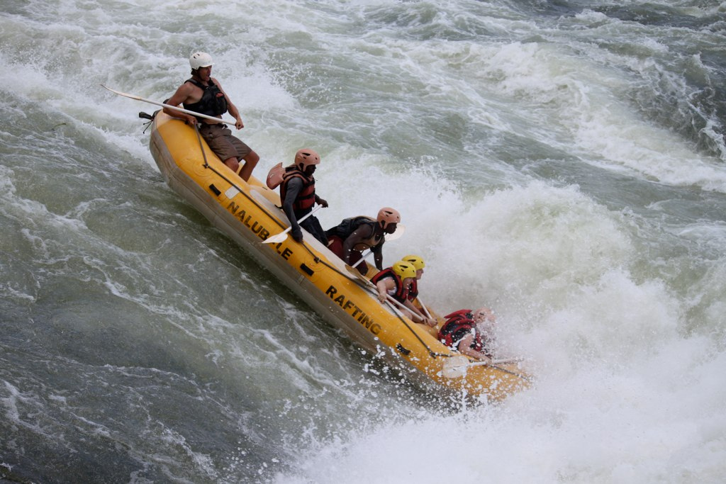 Braving Class V Rapids on the Nile River in Uganda, with Tour Managers Amanda and Christa, and my husband Erik