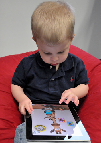 Child with Apple iPad