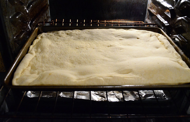 The pizza dough cooking in the oven.