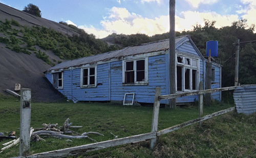old abandoned dilapidated sand dunes kaupokonui taranaki newzealand nz buried house home building derelict