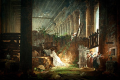 a hermit praying in the ruins of a roman temple