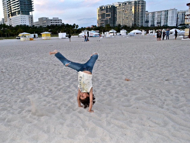 kid playing in the sand of miami beach