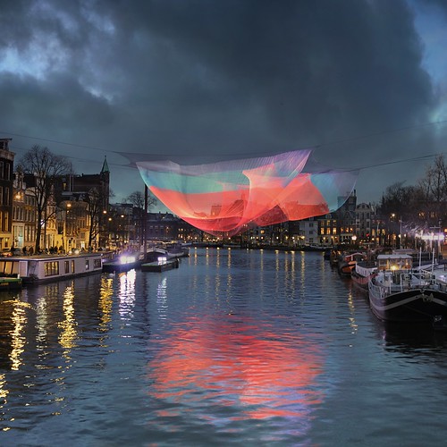 city pink blue winter light sunset red urban sculpture holland colour reflection art net water colors amsterdam festival architecture night river lights hall topf50 colorful wind walk ghost bridges waterloo hour sail janet shape topf100 mokum waterlooplein artworks amstel 126 muziektheater stopera projections sqaure blauwbrug echelman artisticexpression 100faves 50faves illiminated lichtfestival reshapes