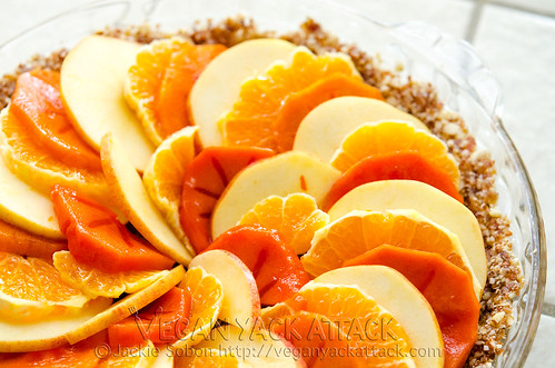Layered winter fruit in a pie dish with crust