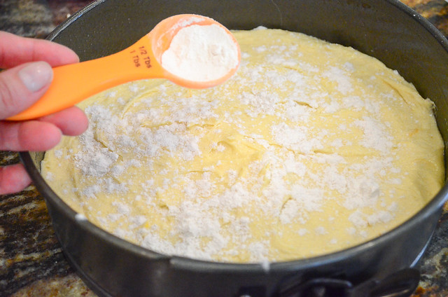 Flour is sprinkled on top of the batter.