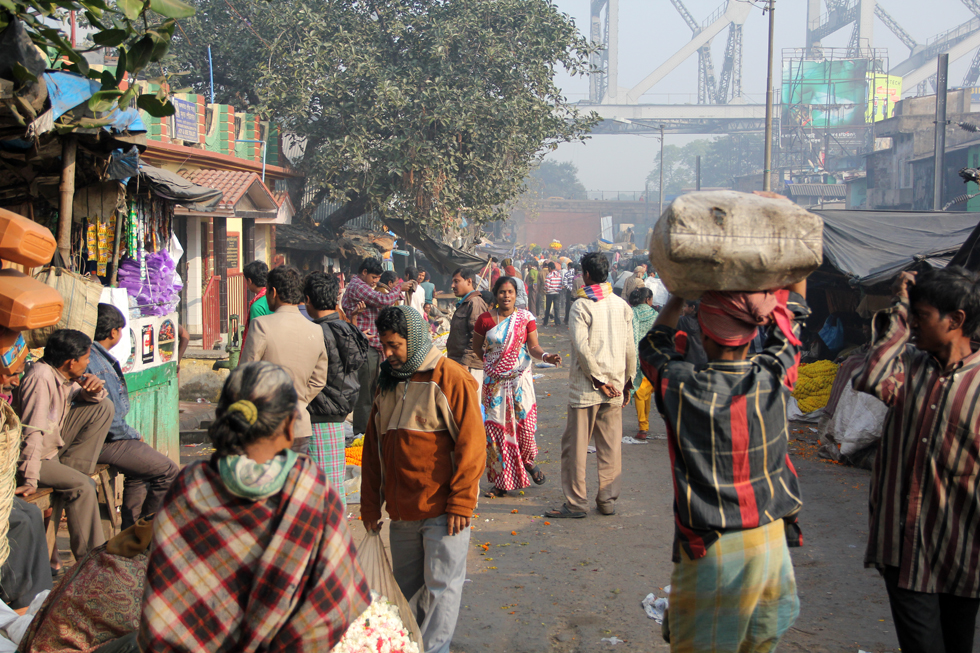 Walking to the flower market, right underneath the Howrah Bridge