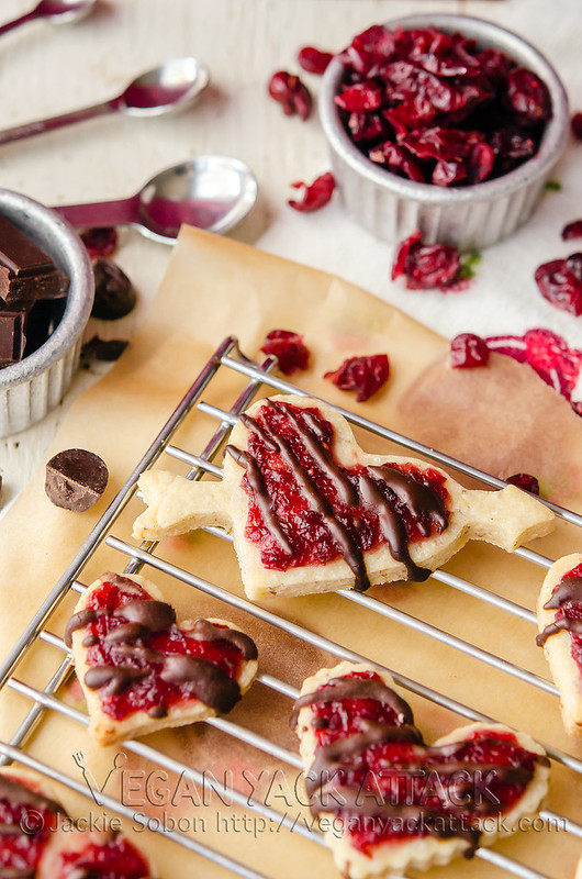 Cranberry Shortbread Cookies- Crunchy shortbread cookies topped with a thin layer of homemade cranberry jam and drizzled with chocolate.