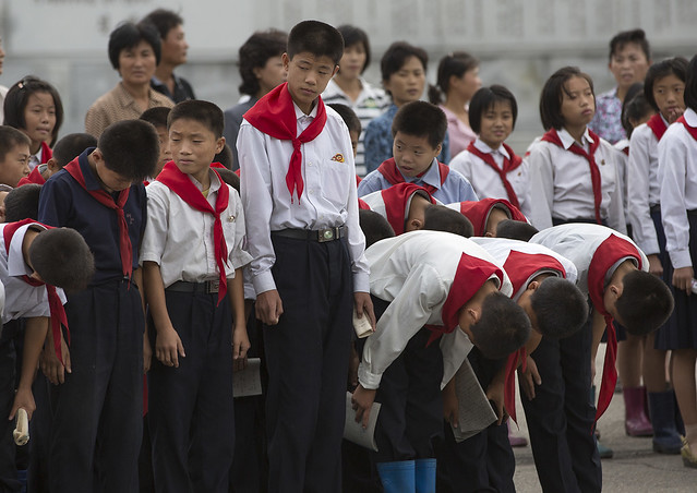 North Korean Pioneers Going To Pay Respect To The Dear Leaders At Mansudae Art Studio, Pyongyang, North Korea