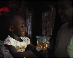 Girl drinking from Kit Yamoyo - this is what success looks like for ColaLife.