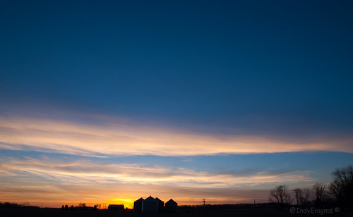 blue sunset sky silhouette clouds gold utilitypole grainbin