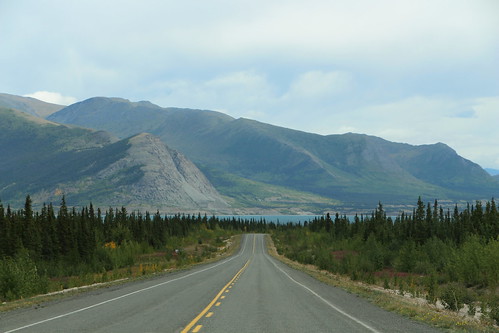 canada yukon territory highway landscape scenery lake mountains road forest nature