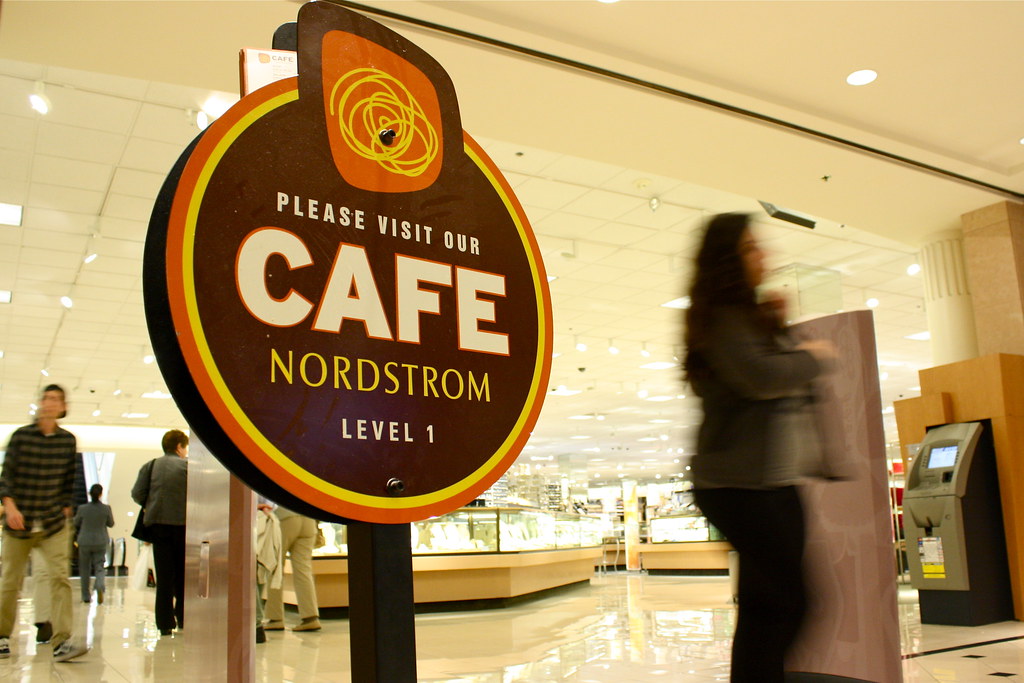 Customers pass a Cafe Nordstrom sign as they exit the store on Friday May 3, 2013. A food handler of the cafe has recently been diagnosed with typhoid fever. Photo by Gabriella Gamboa / Xpress.