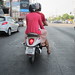 Couple waiting on a moped at Sanambin Nam Road junction