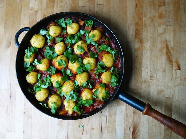 Chickpea flour dumplings with yellow peppers in tomato sauce