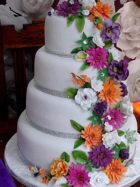 Elegant 4 Tier Colourful Wedding Cake by Caroline Stockwell