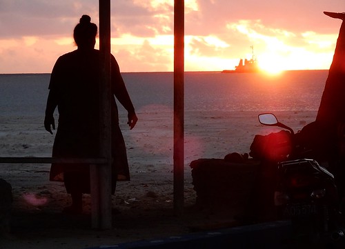 tuvalu funafuti sunset fishingboat overweight large glow woman bun silhouette pacific