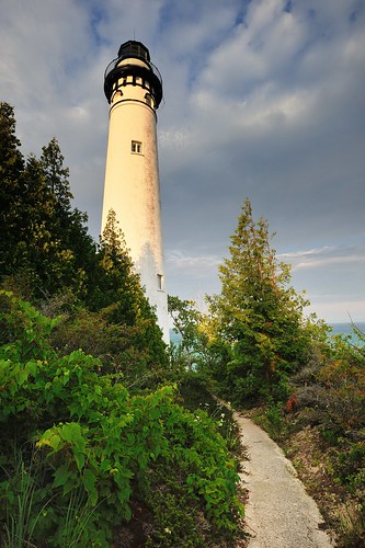 southmanitouisland lighthouse southmanitoulighthouse michigan lakemichigan landmark path vines sky clouds usa great greatlakes midwest island sunset photography