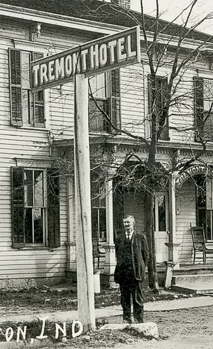 houses people usa signs man men history fence buildings advertising clothing furniture indiana streetscene porch shops hotels residential businesses covington realphoto fountaincounty hoosierrecollections