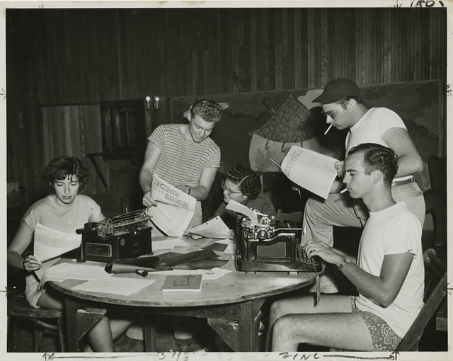Young men and women working on writing for publications at Camp Wel-Met, 1948
