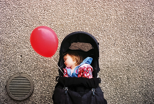 Sleeping and Still holding onto balloon