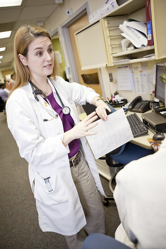 Doctors and residents working with patients at the JFK clinic in St. Louis. Elizabeth Mahon, MD