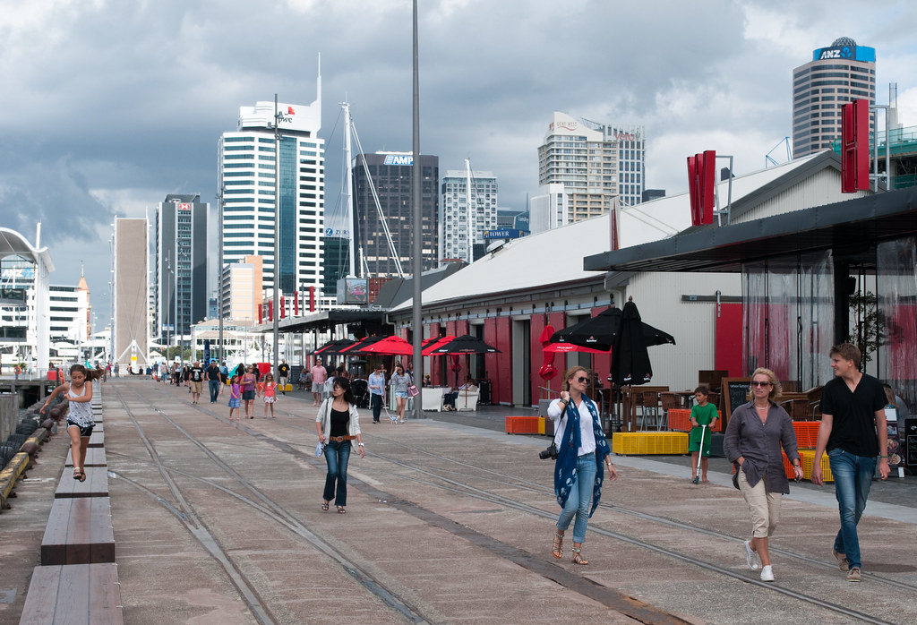 Pedestrians on boardwalk near Silo Park - facing downtown Auckland