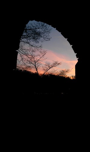 trees winter sunset sky sun brick sign arch