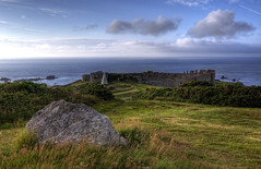 the top of a Neolithic cist burial with Fort Torgis in the background - Alderney