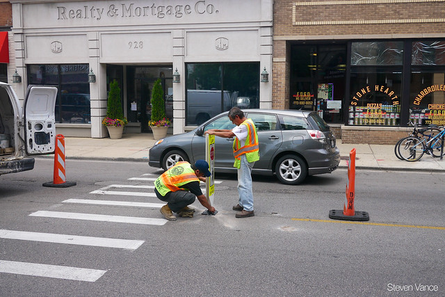 Stop for pedestrians in crosswalk sign installation
